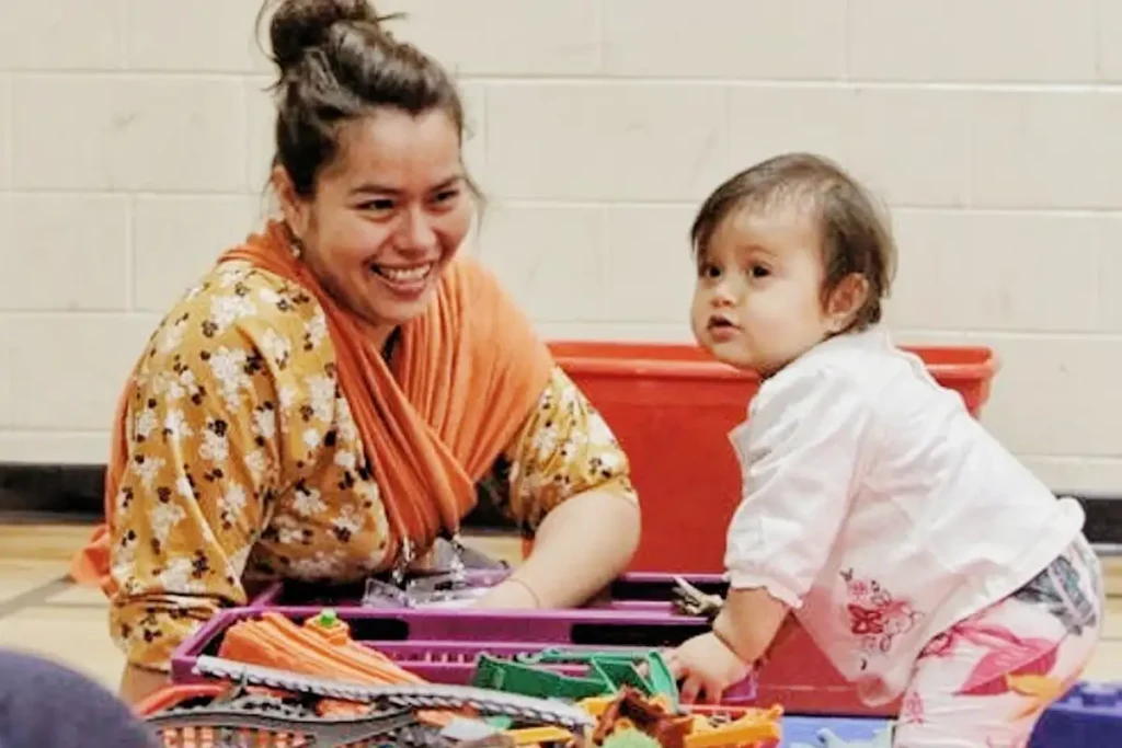 Mother and child at Kerr Street Mission in Oakville, Ontario participating in family service programs.